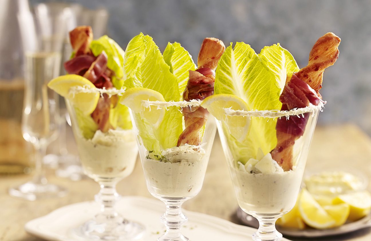 baba ghanouj Caesar salad in a champagne glass
