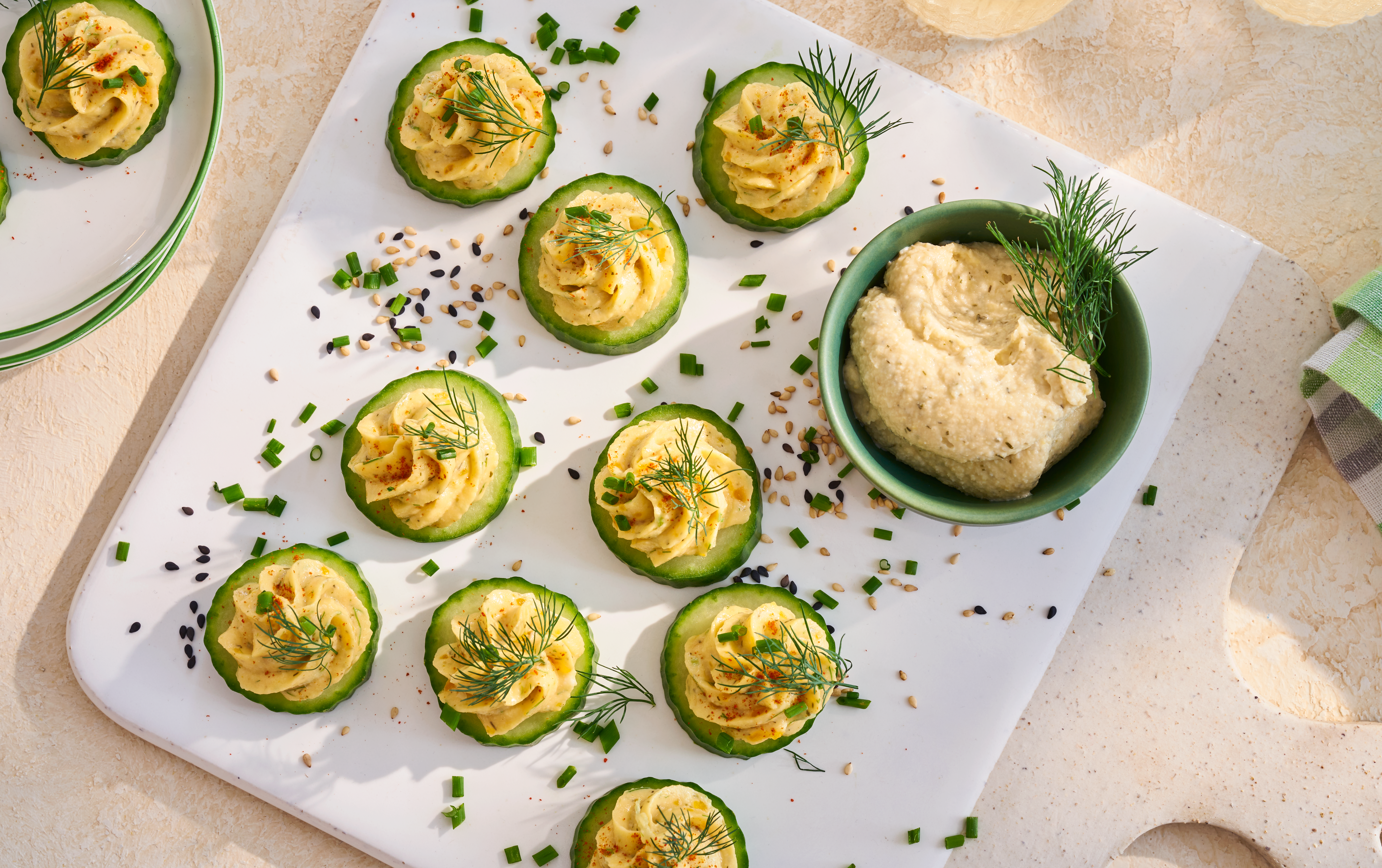 cucumber slices with dill pickle on top